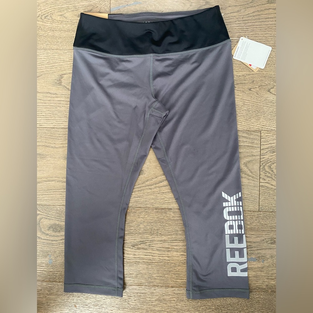 Reebok gray and black skinny capri leggings. Size S. NWT